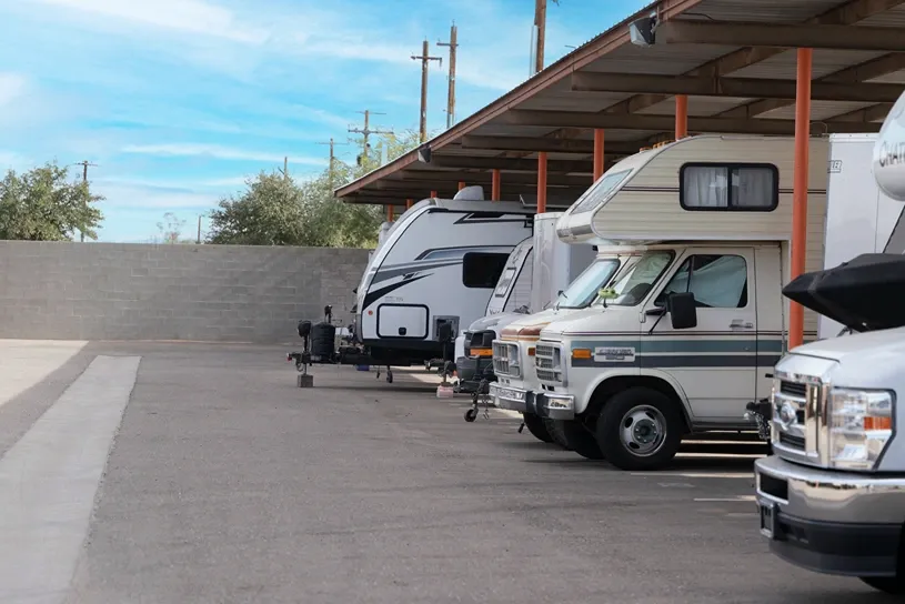 Covered RV and vehicle storage parking with canopy protection at self storage facility
